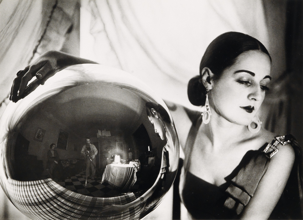 JACQUES-HENRI LARTIGUE (1894-1986) Renée Perle with glass ball (self-portrait).